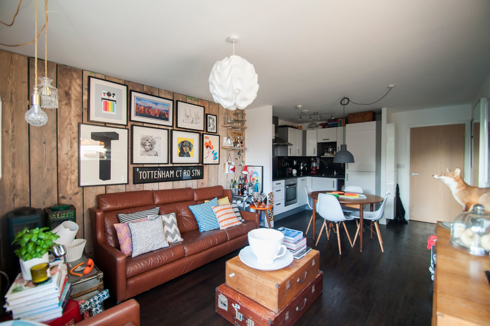 Medium sized eclectic formal open plan living room in London with white walls and a freestanding tv.