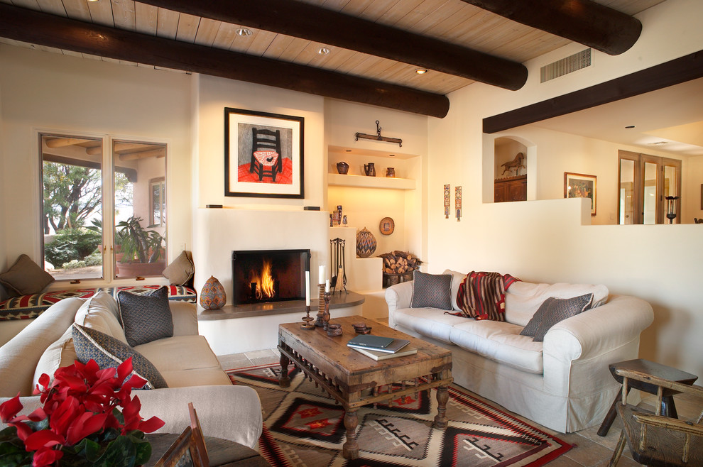 Living room in Phoenix with white walls and a standard fireplace.