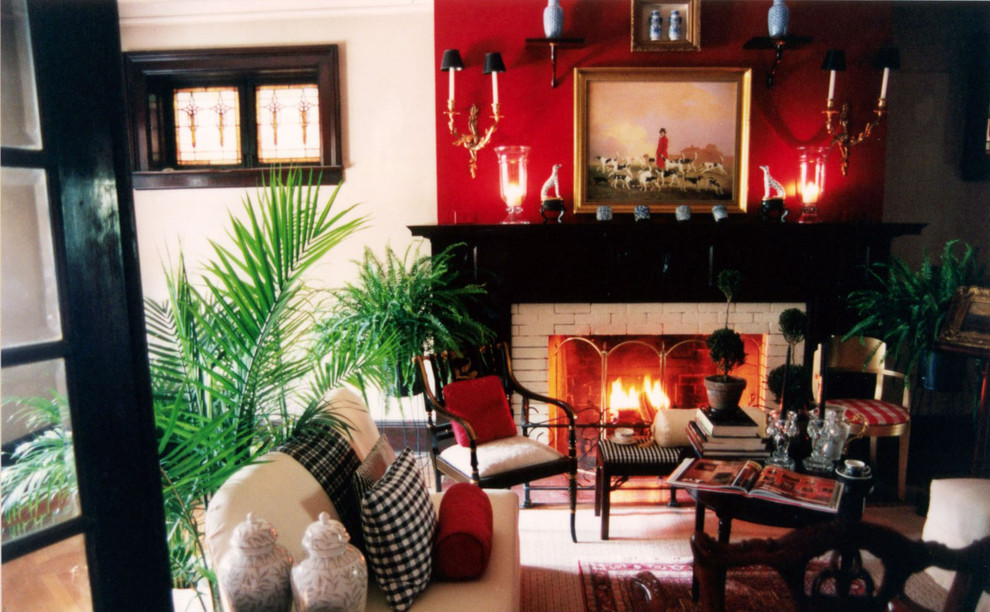 Medium sized victorian formal enclosed living room in Nashville with red walls, carpet, a standard fireplace and a stone fireplace surround.