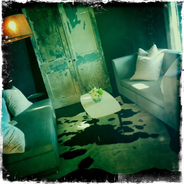 Eclectic gray living room, vintage doors, modern couches, arc floor