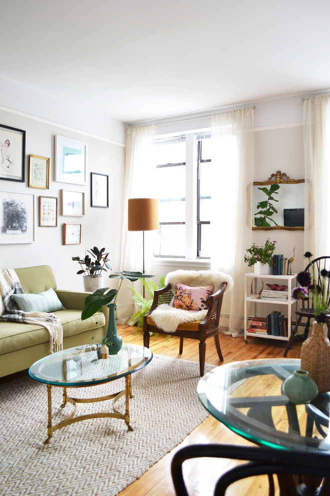 Inspiration for an eclectic living room in New York with beige walls, medium hardwood flooring and feature lighting.