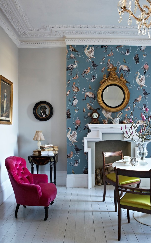 Medium sized eclectic formal open plan living room feature wall in Sussex with blue walls, painted wood flooring, a standard fireplace, a plastered fireplace surround and no tv.