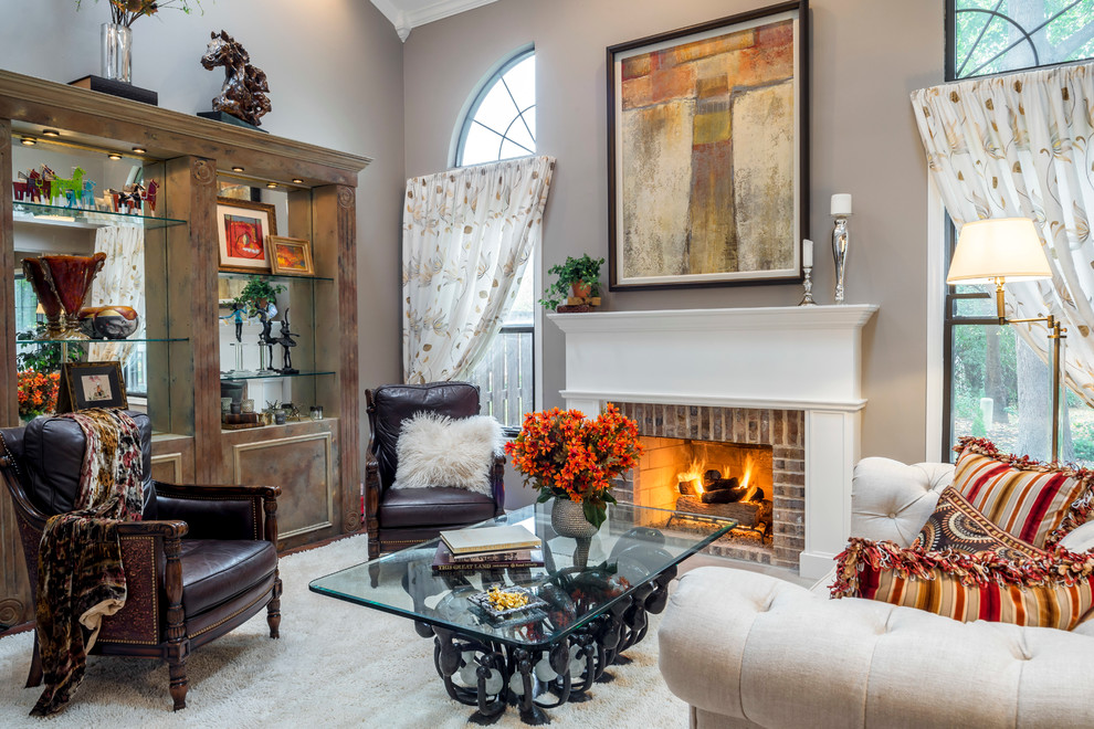 Inspiration for a medium sized eclectic open plan living room in Phoenix with beige walls, dark hardwood flooring, a standard fireplace, a brick fireplace surround and no tv.