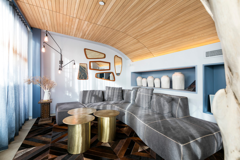 Esempio di un soggiorno moderno con pareti blu
