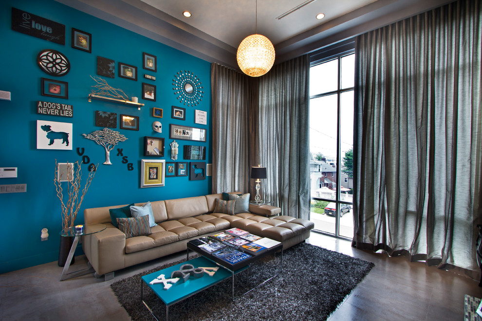 Example of a trendy living room design in New York with blue walls