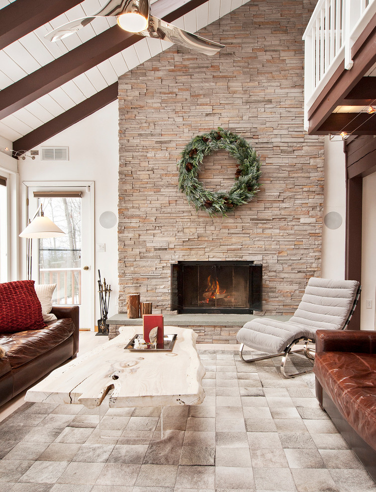 Design ideas for a large rustic formal open plan living room in New York with a standard fireplace, a stone fireplace surround, no tv and feature lighting.