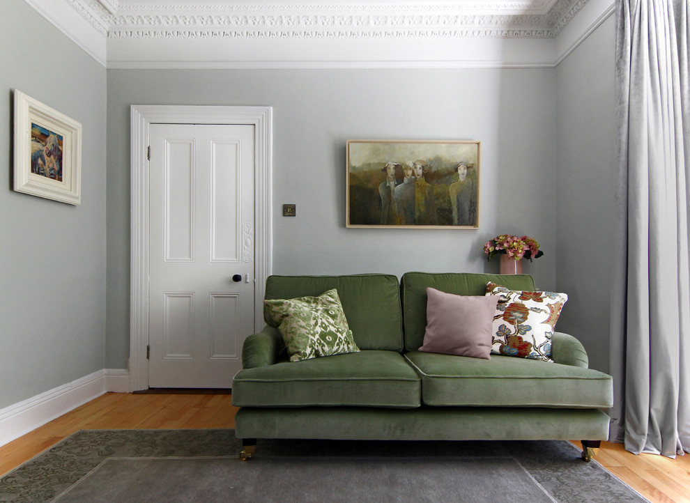 Elegant medium tone wood floor living room photo in Other