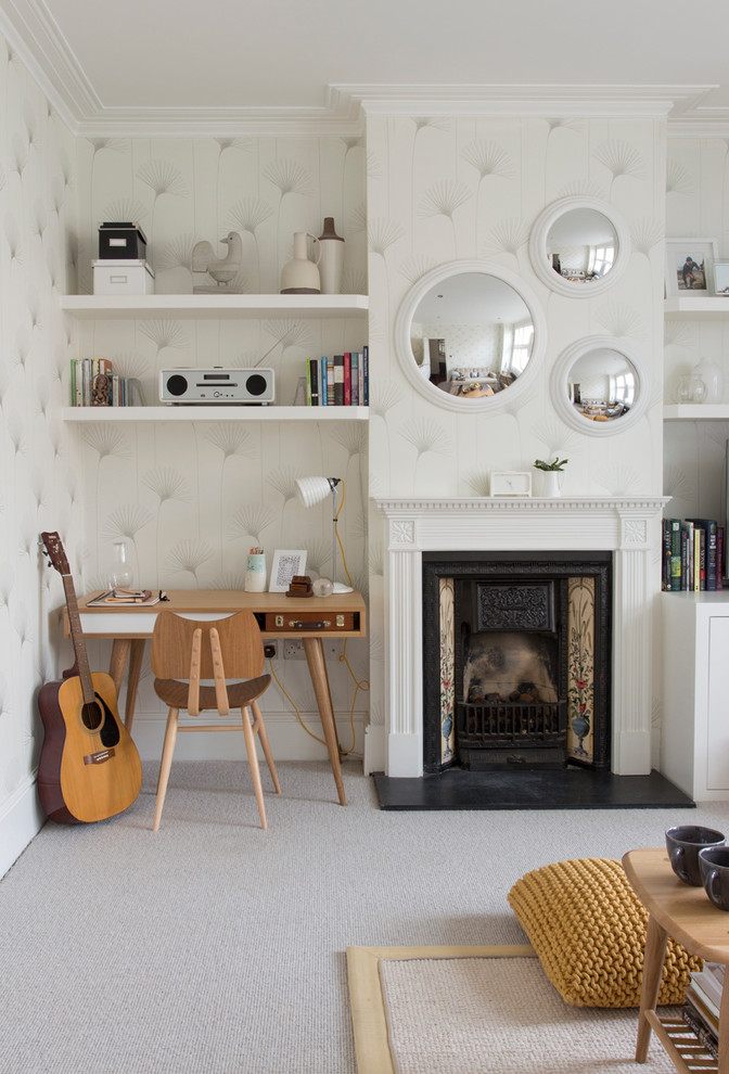 Living room - contemporary carpeted living room idea in London with a music area, beige walls, a standard fireplace and no tv