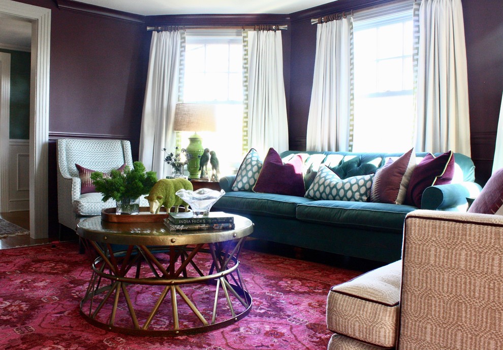 This is an example of a medium sized bohemian enclosed living room in New York with a reading nook, purple walls, dark hardwood flooring, a standard fireplace, a stone fireplace surround, a built-in media unit and multi-coloured floors.