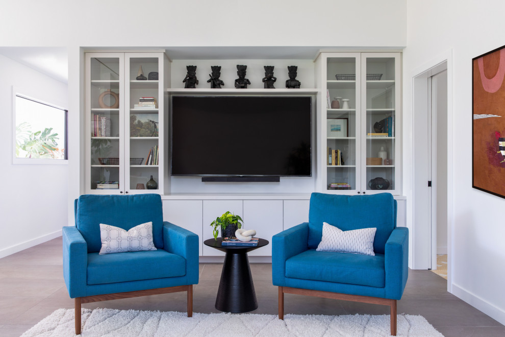 Photo of a large retro grey and teal open plan living room in San Francisco with white walls, porcelain flooring, no fireplace, a built-in media unit and grey floors.
