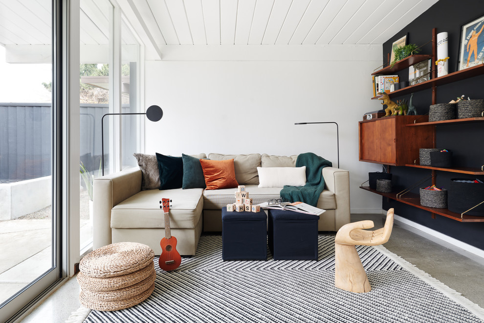 Idee per un soggiorno scandinavo con pareti bianche e pavimento grigio