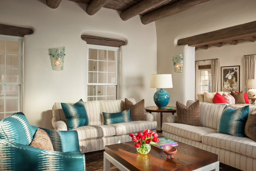 Inspiration for a southwestern formal living room remodel in Albuquerque with white walls