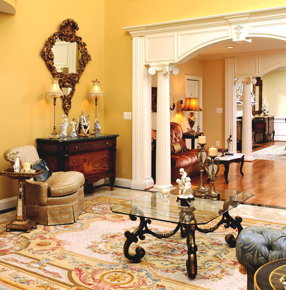 This is an example of a medium sized classic living room in DC Metro with yellow walls and beige floors.