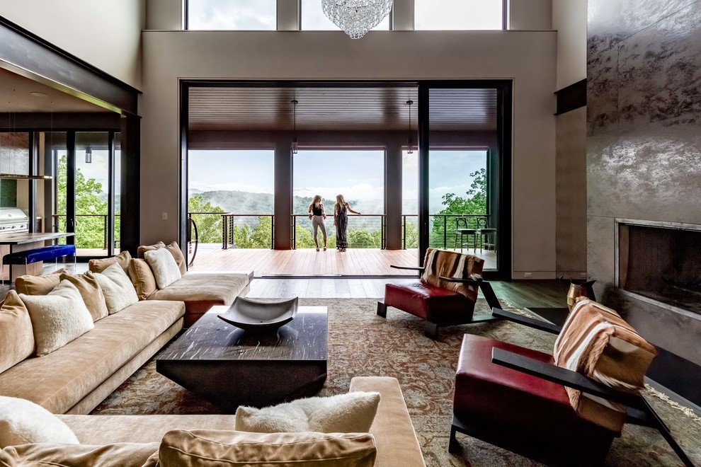 Esempio di un grande soggiorno minimal aperto con pareti beige, parquet scuro e pavimento marrone