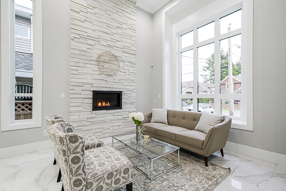 Design ideas for a medium sized contemporary formal open plan living room in Vancouver with grey walls and a standard fireplace.