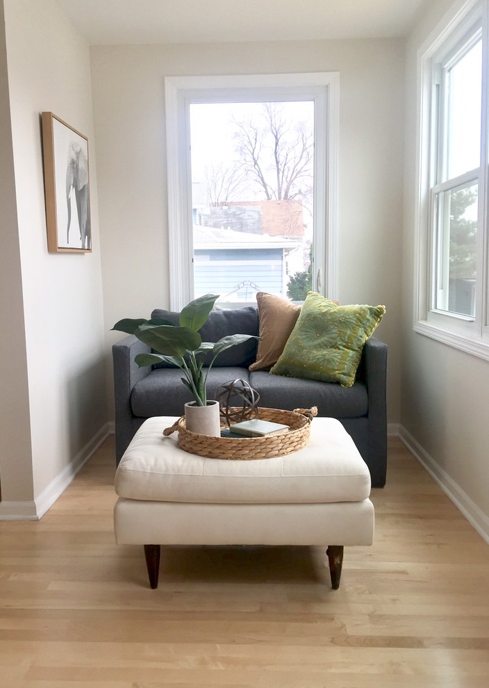 Example of a small danish formal and enclosed light wood floor and beige floor living room design in Chicago with gray walls, no fireplace and no tv