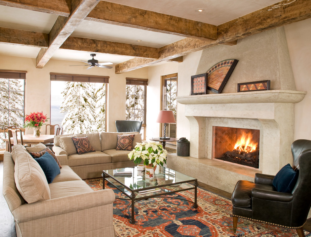 Living room - large rustic formal and open concept medium tone wood floor living room idea in Other with a standard fireplace, a stone fireplace, beige walls and no tv