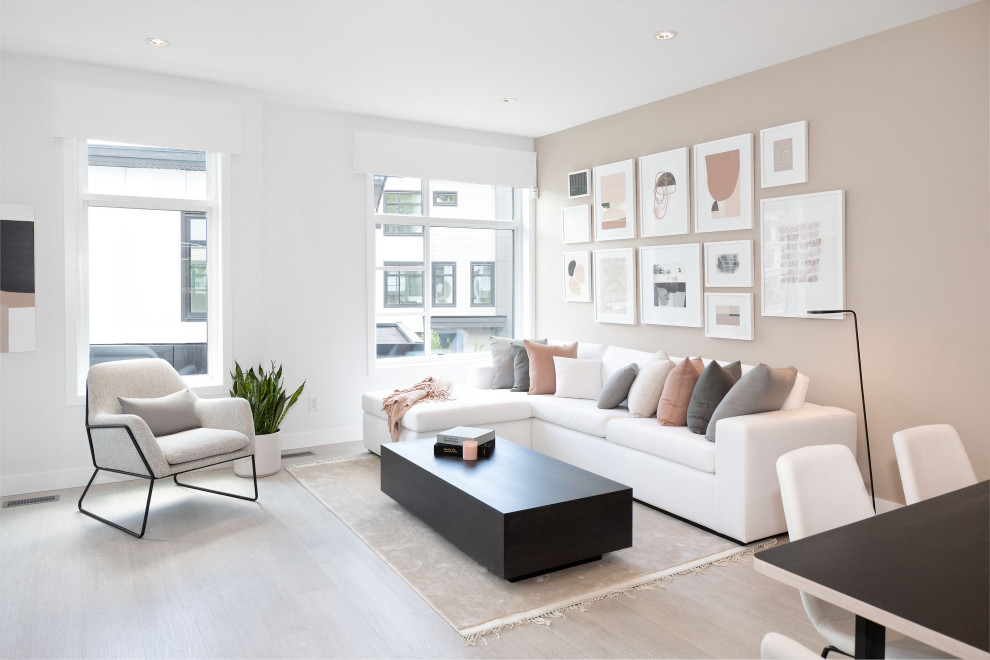 Mid-sized danish open concept laminate floor and beige floor living room photo in Vancouver with beige walls