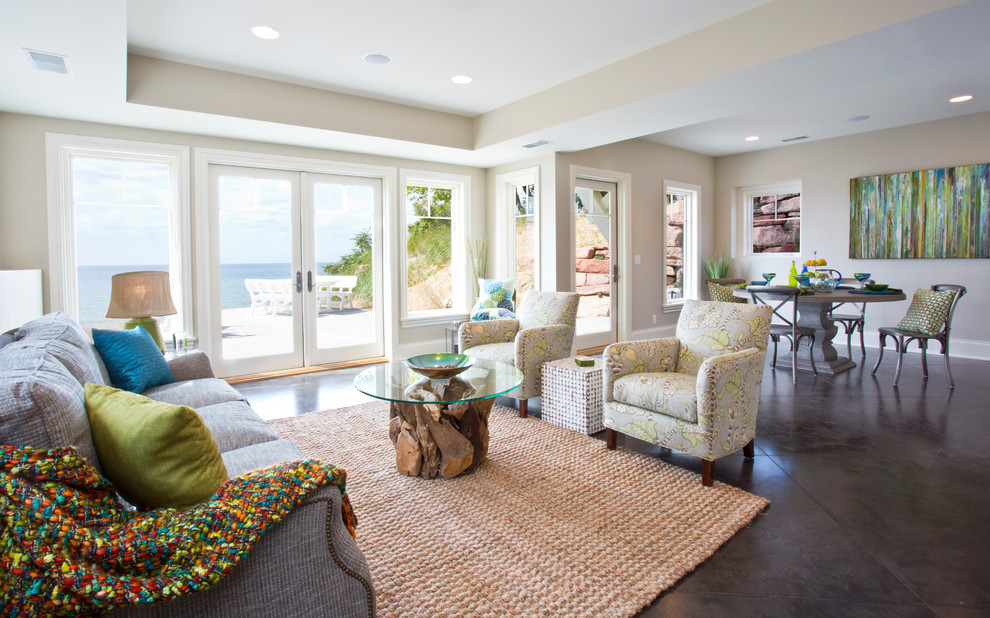 Living room - large coastal open concept ceramic tile living room idea in Grand Rapids with beige walls