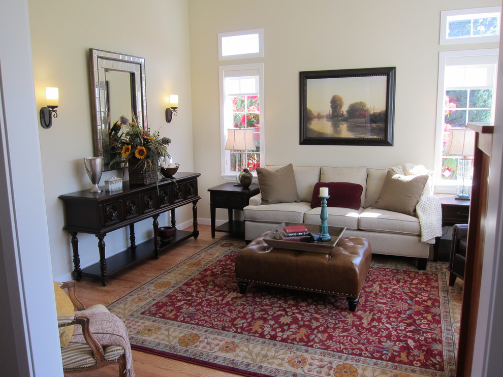 Photo of a medium sized traditional open plan living room in Seattle with beige walls and light hardwood flooring.