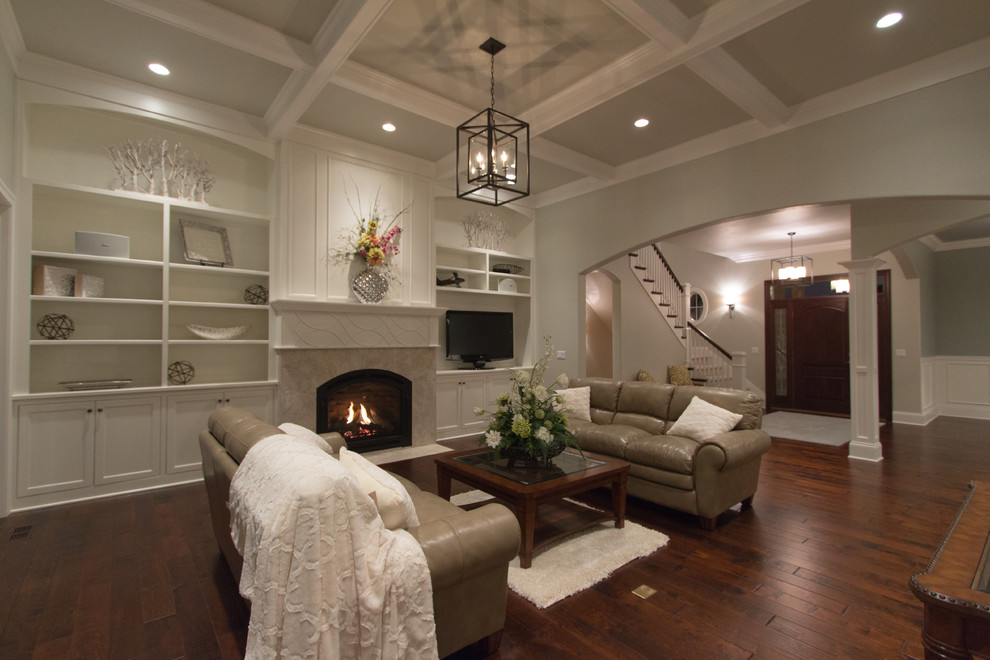 Inspiration for a transitional open concept carpeted living room remodel in Milwaukee with beige walls, a standard fireplace, a stone fireplace and a tv stand