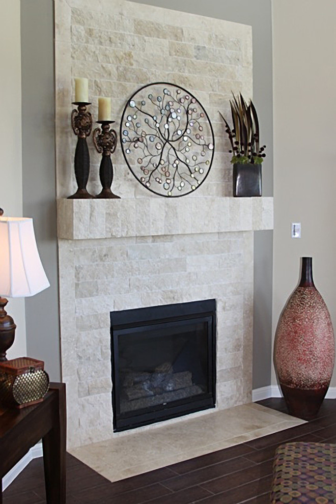 This is an example of a small classic enclosed living room in Los Angeles with porcelain flooring, a standard fireplace and a stone fireplace surround.