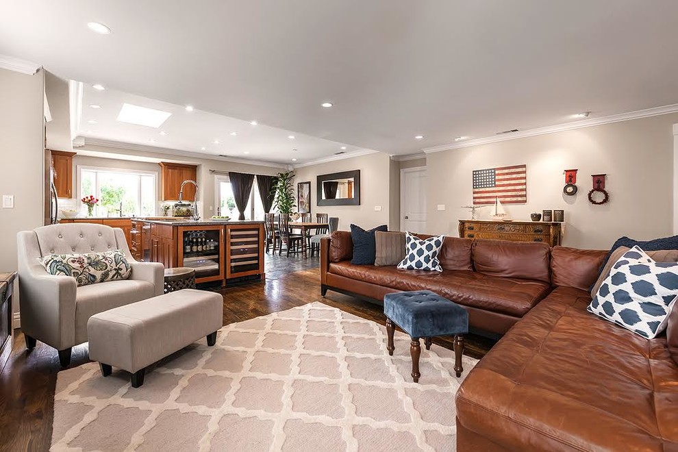 Photo of a large modern formal open plan living room in San Francisco with beige walls, dark hardwood flooring, no fireplace and a freestanding tv.