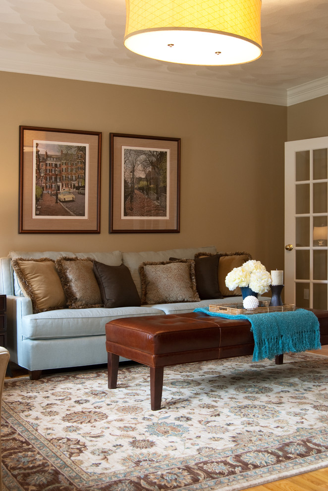 Elegant living room photo in Boston with beige walls