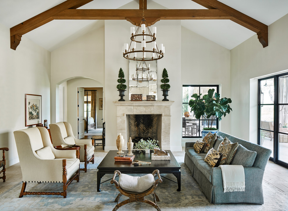 This is an example of a mediterranean formal living room in Other with beige walls, a standard fireplace and no tv.