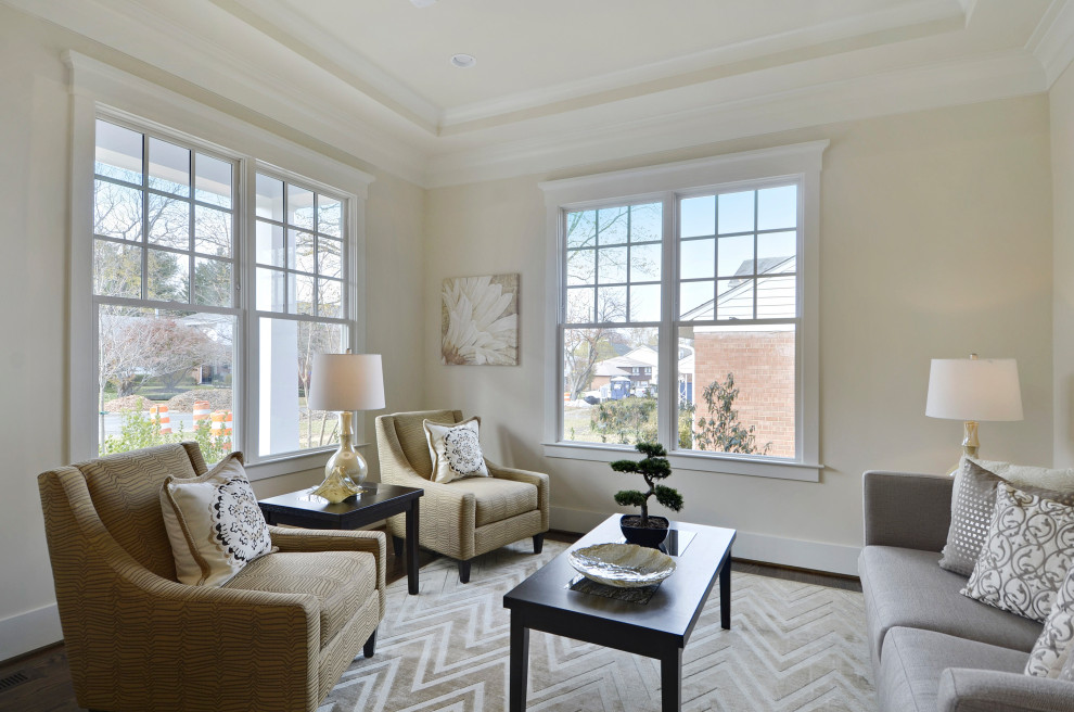 Medium sized classic formal enclosed living room in DC Metro with beige walls, dark hardwood flooring and brown floors.