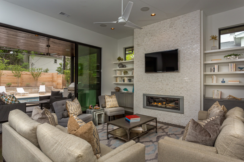 Example of a trendy living room design in Austin with a ribbon fireplace