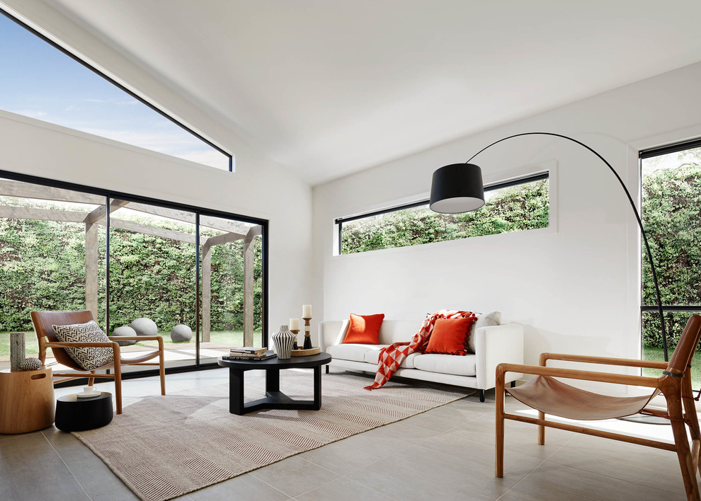 Medium sized contemporary formal open plan living room in Melbourne with white walls.