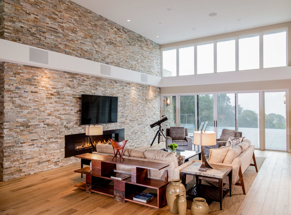 Expansive Living Room in Passive House with Floor-to-Ceiling Windows ...