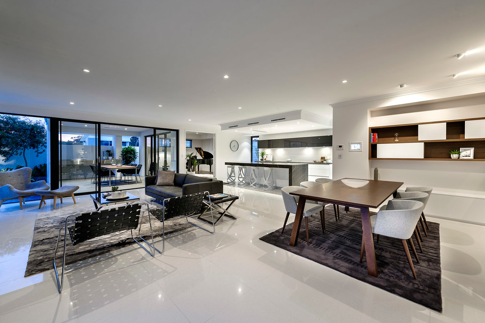 Ispirazione per un soggiorno design aperto con pavimento con piastrelle in ceramica e TV a parete