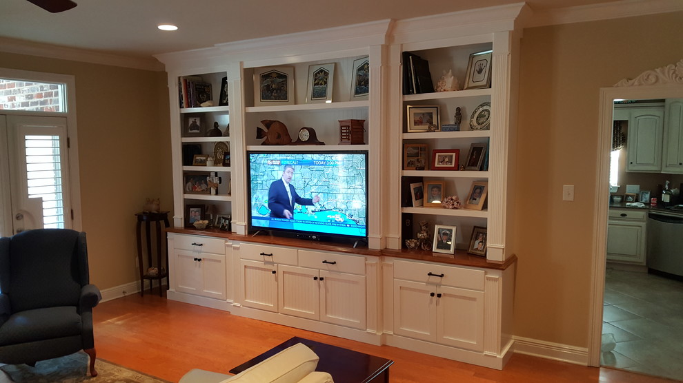 Photo of a medium sized classic enclosed living room in Miami with brown walls, light hardwood flooring, no fireplace, a built-in media unit and beige floors.