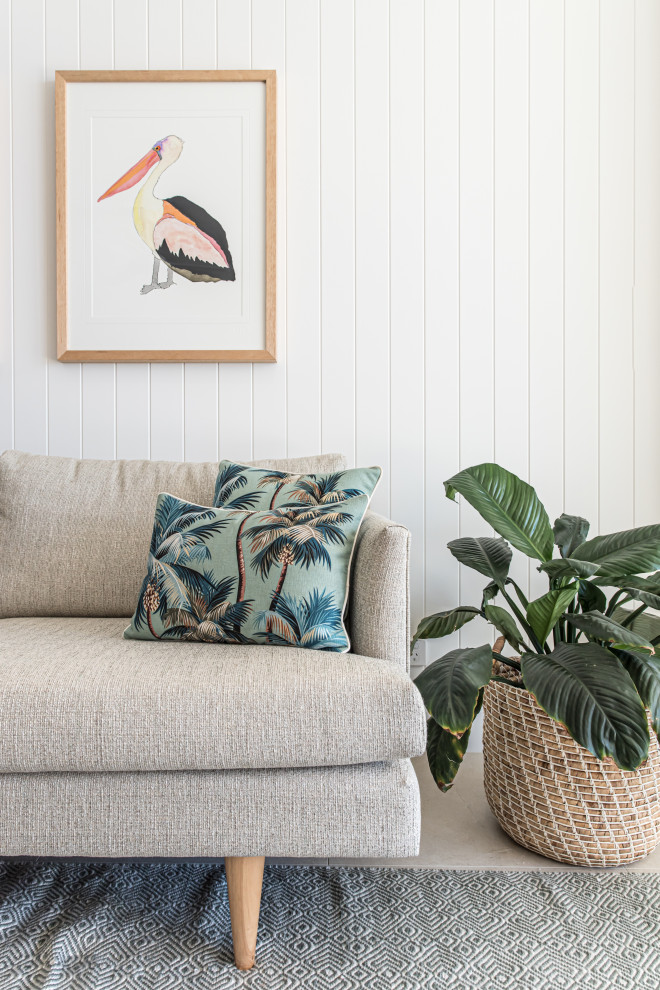 Inspiration for a small coastal living room in Sunshine Coast with white walls, porcelain flooring and beige floors.
