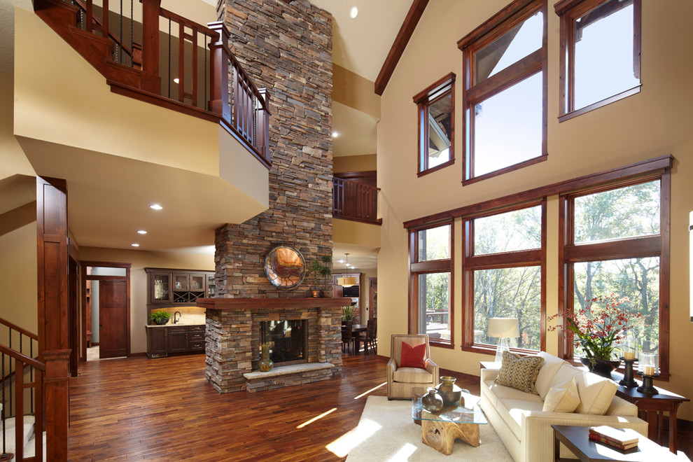 Photo of a classic living room in Minneapolis with a two-sided fireplace.