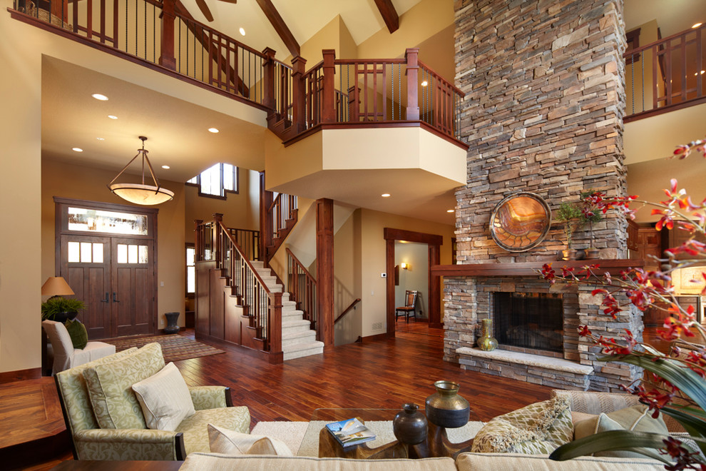 This is an example of a traditional living room in Minneapolis with a two-sided fireplace.