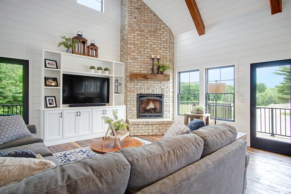 Photo of a farmhouse living room in Grand Rapids with feature lighting.