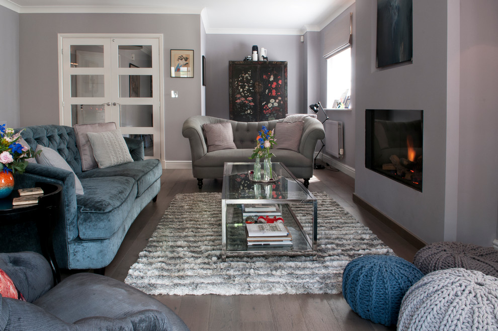 This is an example of a large contemporary living room in Kent with grey walls.