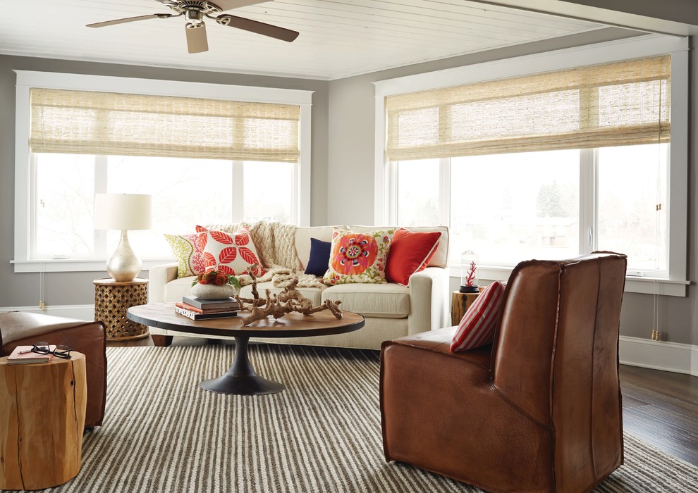 Inspiration for a mid-sized coastal dark wood floor and brown floor living room remodel in Charlotte with brown walls