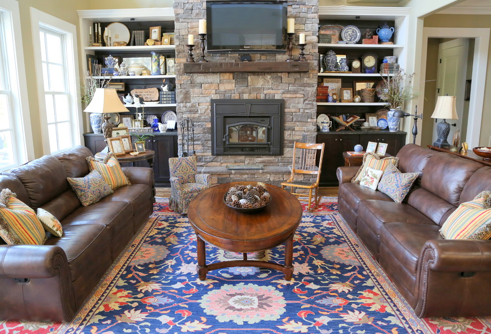 Design ideas for a large traditional living room in Nashville with beige walls, a standard fireplace, a stone fireplace surround and a wall mounted tv.