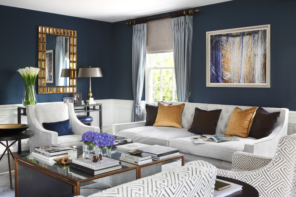 На фото: большая парадная, изолированная гостиная комната в классическом стиле с синими стенами, темным паркетным полом, стандартным камином, фасадом камина из камня и телевизором на стене с