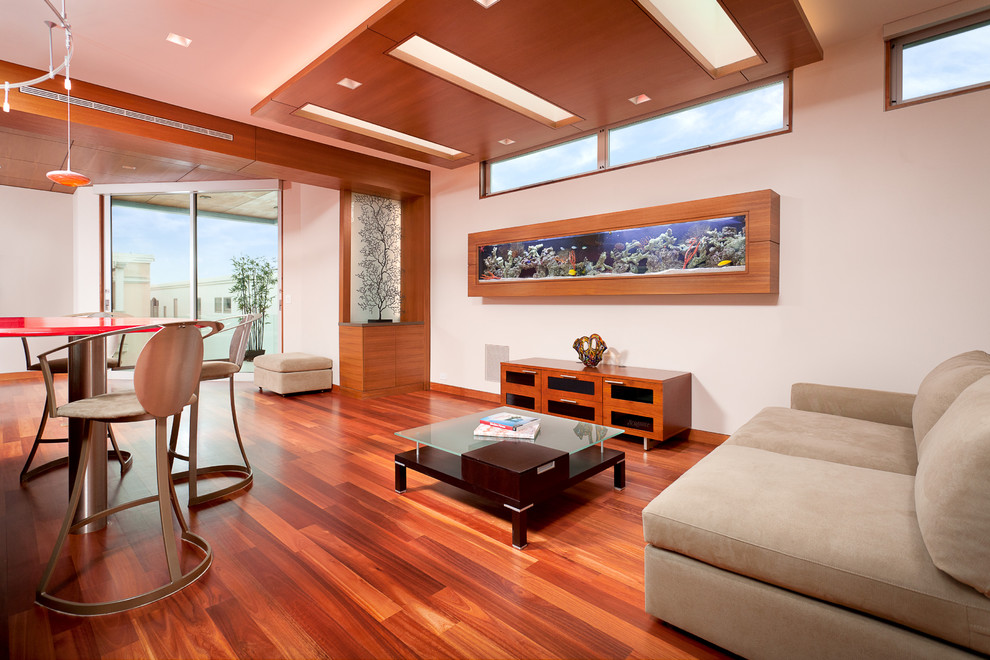 Living room - mid-sized contemporary enclosed medium tone wood floor and red floor living room idea in Los Angeles with white walls