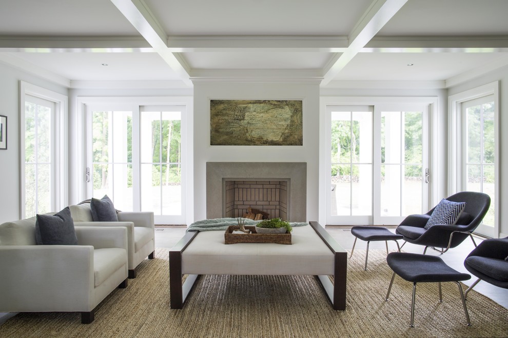 Example of a mid-sized transitional formal and enclosed dark wood floor living room design in New York with white walls, a standard fireplace, a stone fireplace and no tv