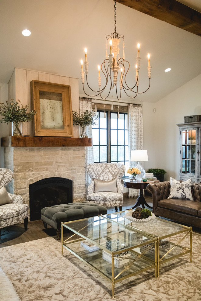 Large cottage open concept medium tone wood floor living room photo in Oklahoma City with white walls, a standard fireplace and a stone fireplace
