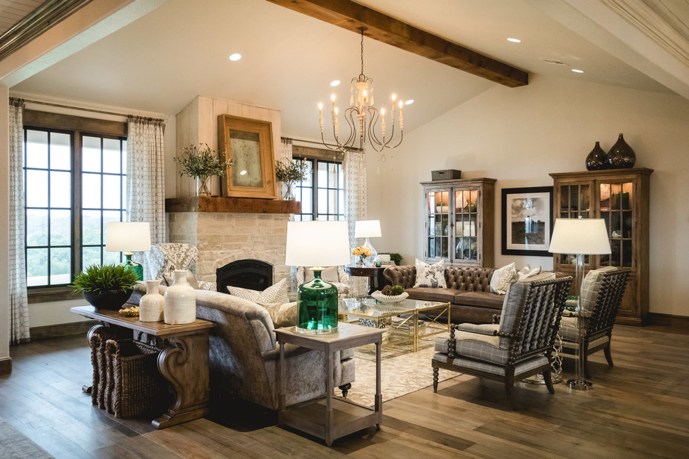 Living room - cottage open concept medium tone wood floor living room idea in Oklahoma City with white walls, a standard fireplace and a stone fireplace