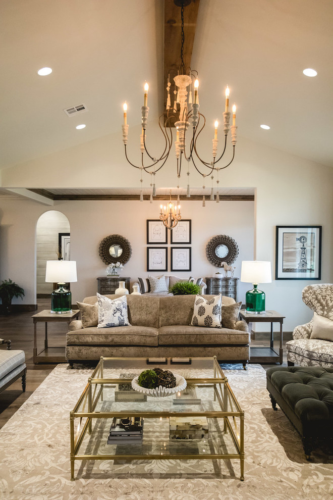 Inspiration for a large farmhouse open concept medium tone wood floor living room remodel in Oklahoma City with white walls, a standard fireplace and a stone fireplace
