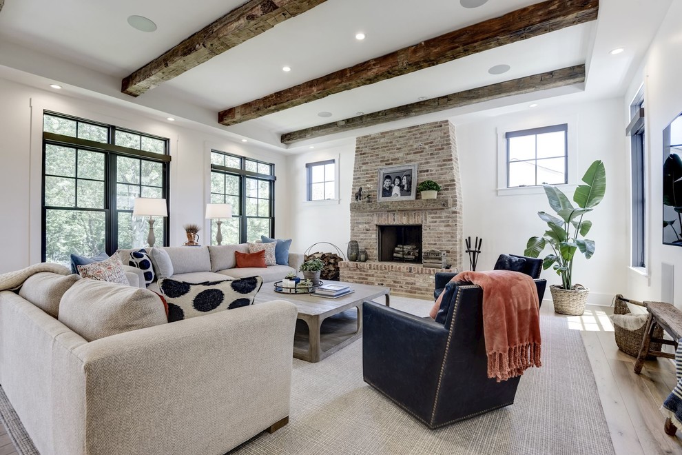 Transitional enclosed light wood floor living room photo in DC Metro with white walls, a standard fireplace and a brick fireplace