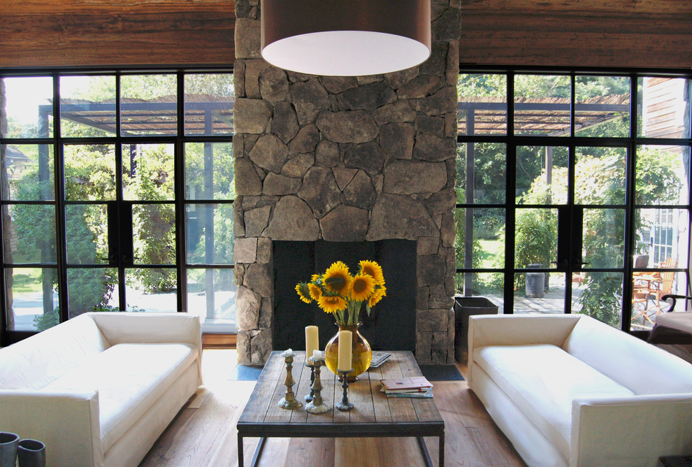 Inspiration for a cottage living room remodel in New York with a stone fireplace and no tv